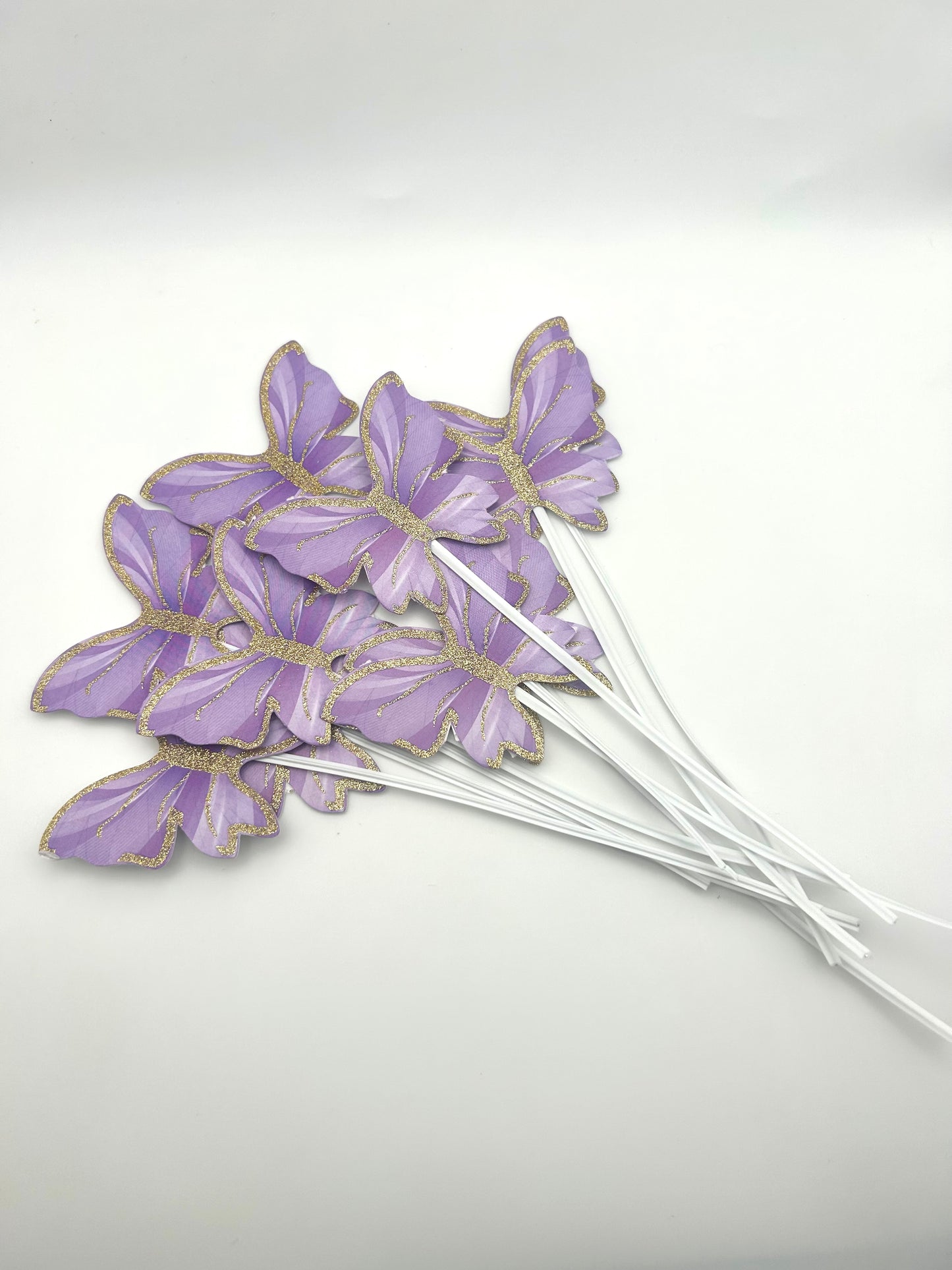 Marbled Purple butterflies with stick