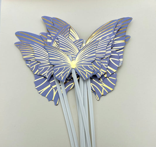 Purple and gold butterflies with stick