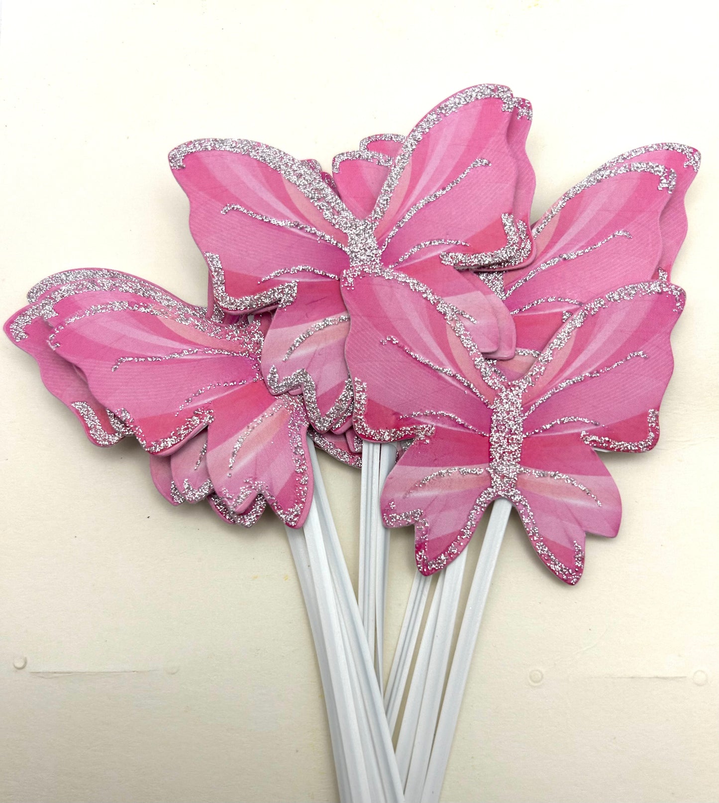 Pink butterflies with stick
