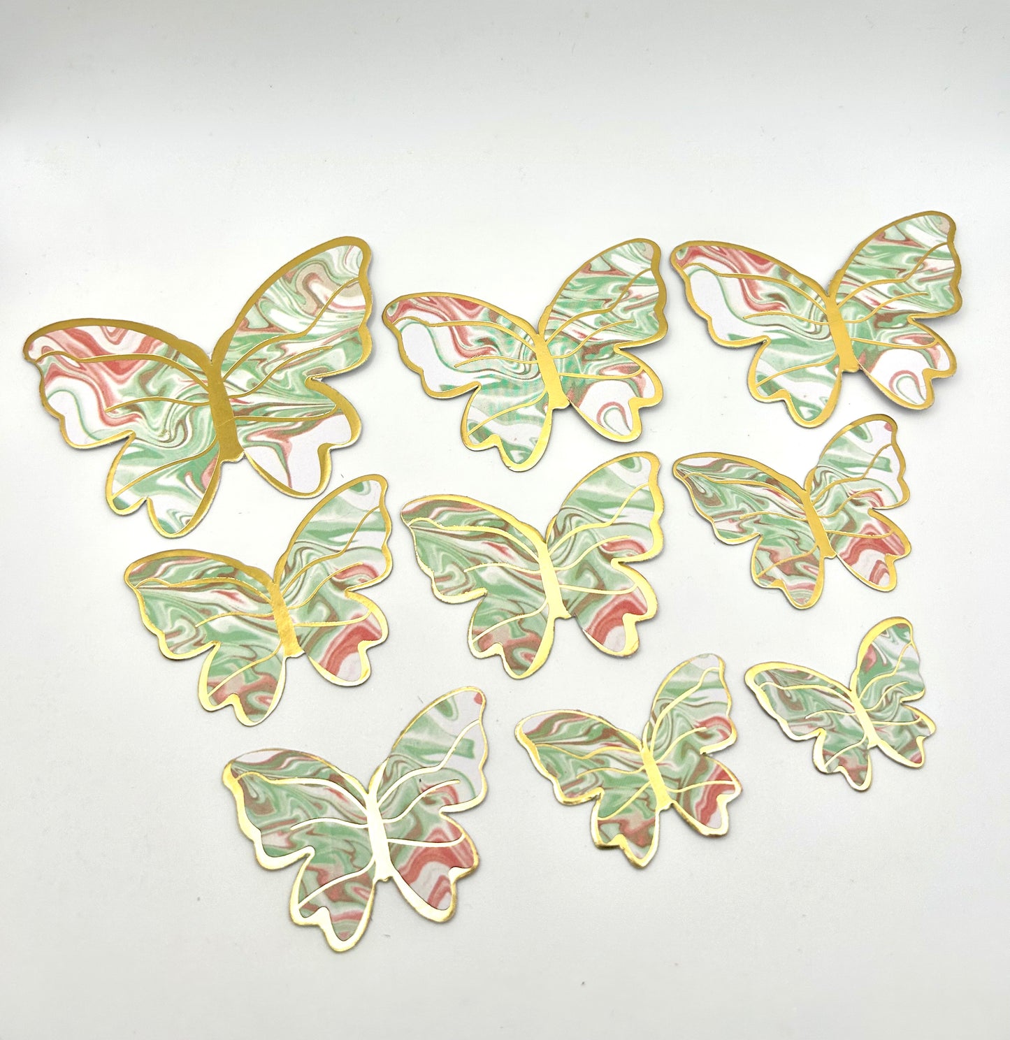 Marbled green, pink and white butterflies