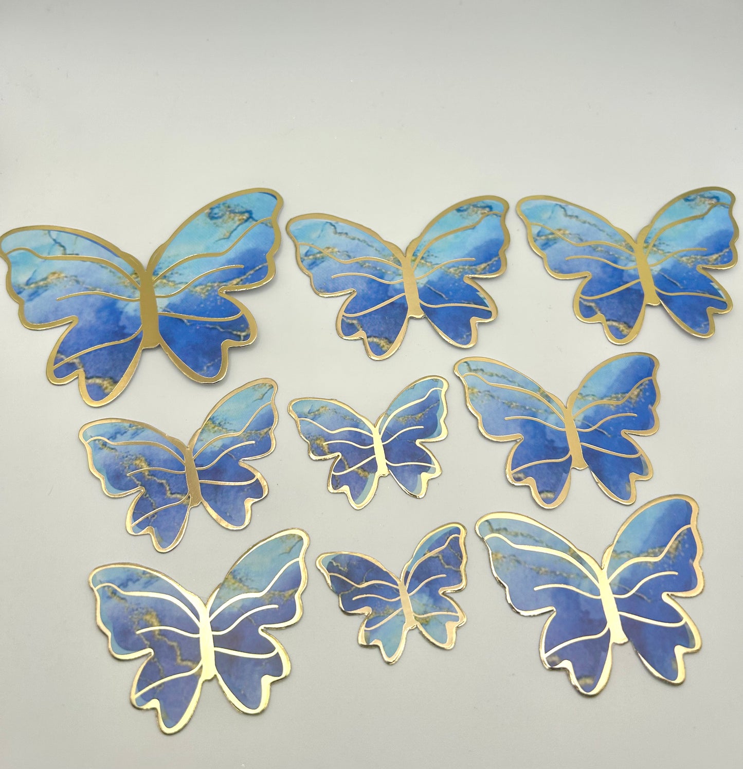 Marbled blue and gold butterflies